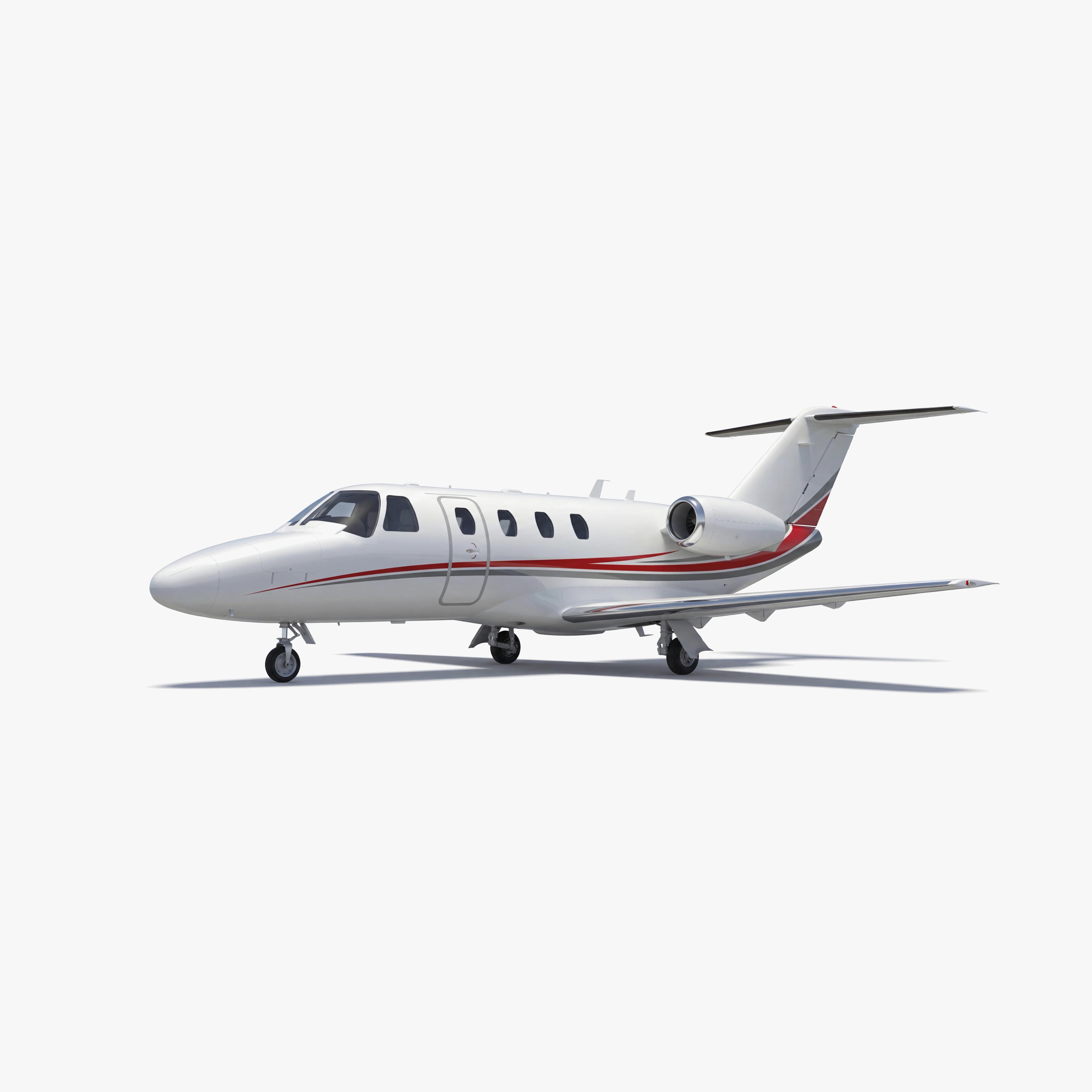 White Citation CJ1 light jet with red accent stripes on neutral background, showcasing sleek design