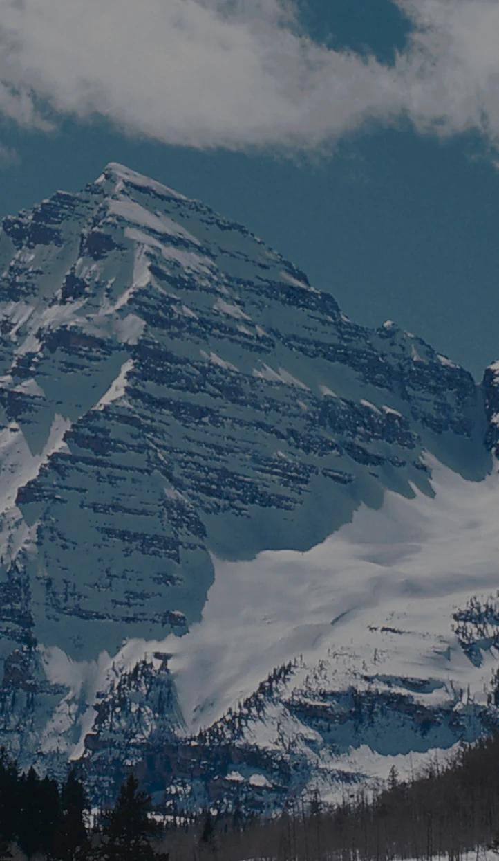 Snow-capped mountain peaks and glaciers in Aspen, Colorado - premier ski destination for luxury travel