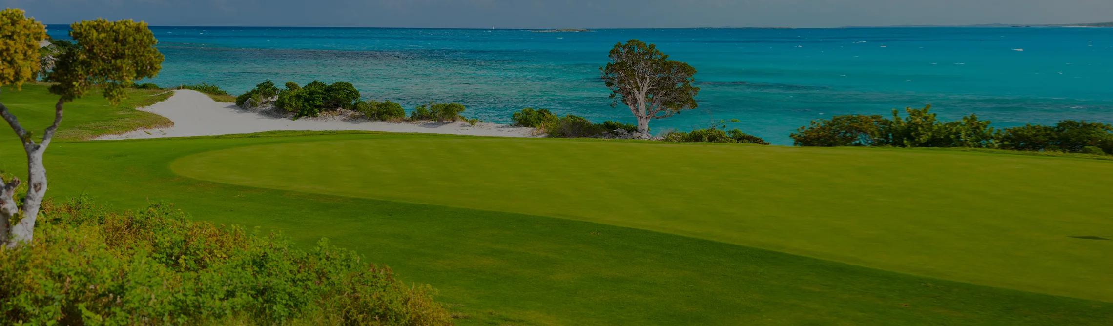 Pristine oceanfront golf course in Palm Beach with emerald fairways overlooking turquoise waters