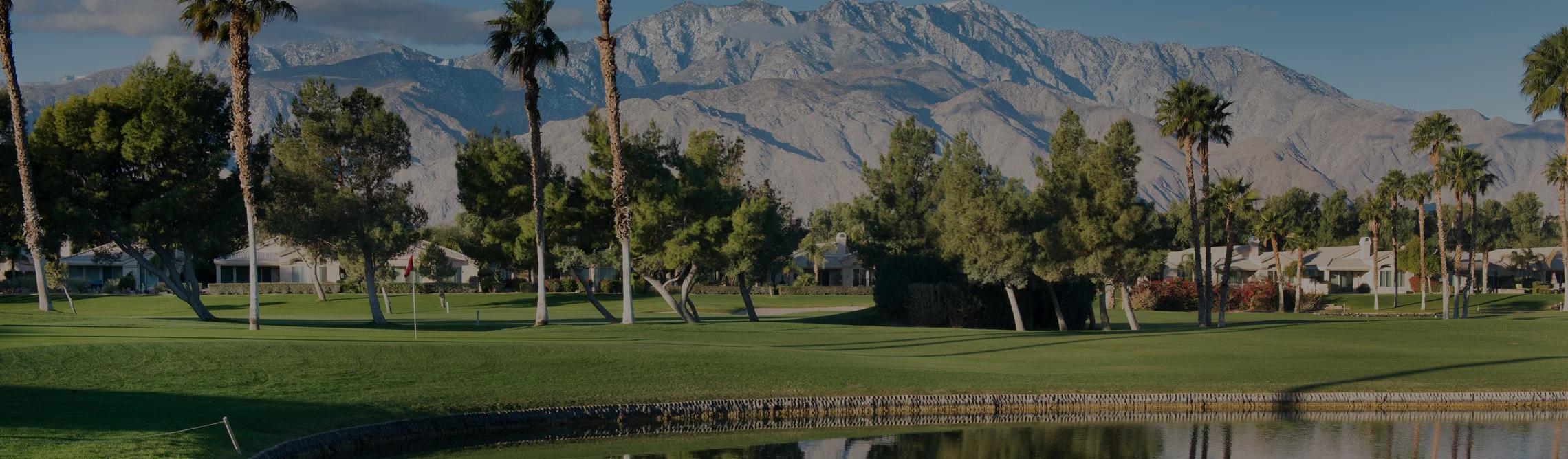 Pristine golf course fairway in Palm Springs with snow-capped San Jacinto Mountains backdrop