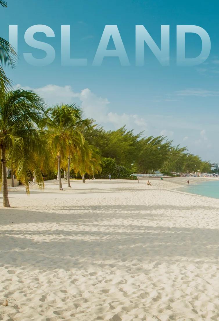 Pristine white sand beach with swaying palm trees and turquoise Caribbean waters in Grand Cayman