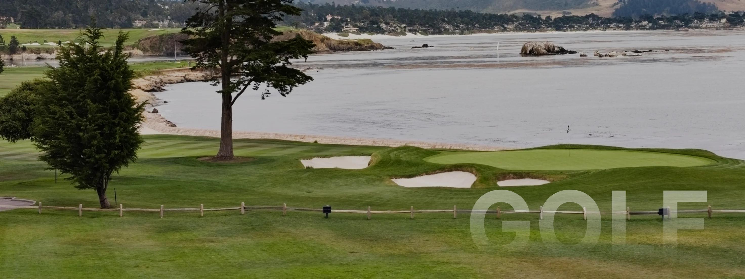 Scenic Pebble Beach golf course with pristine green fairways, sand bunkers, and Pacific Ocean coastline