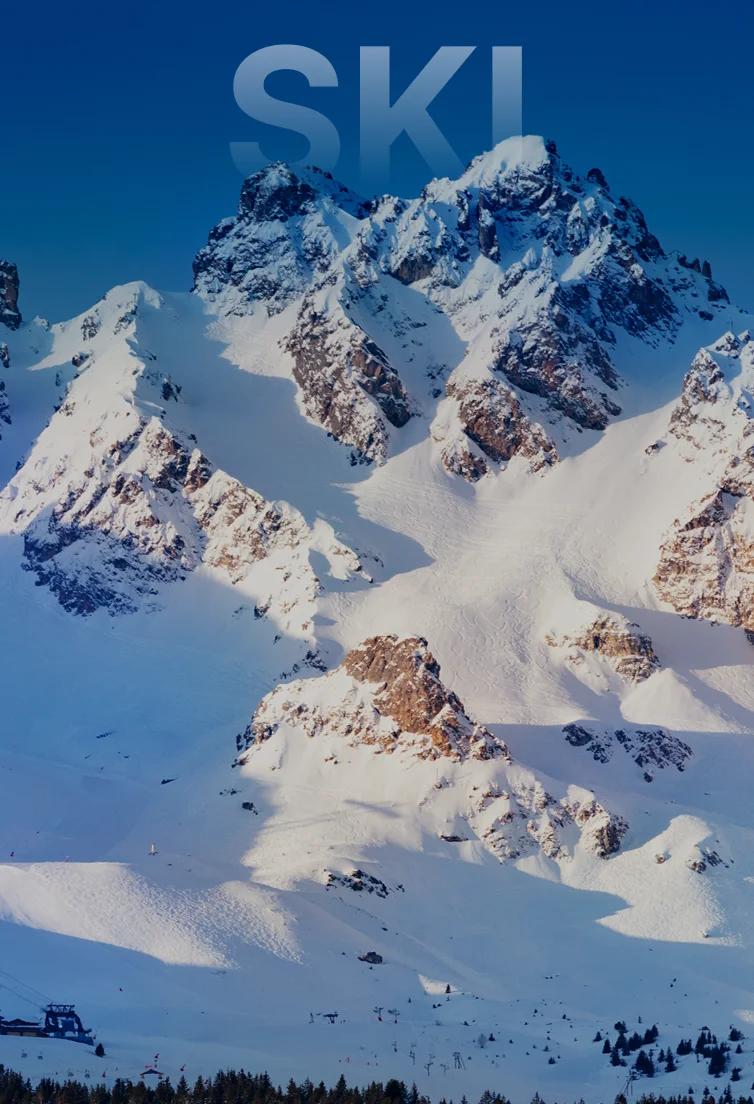 Snow-covered mountain peaks and alpine ridges under clear blue skies in Sun Valley ski destination