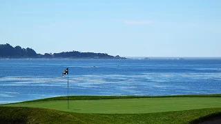 Pristine golf green with flagstick overlooking Pacific Ocean coastline and rugged cliffs at Bandon Dunes