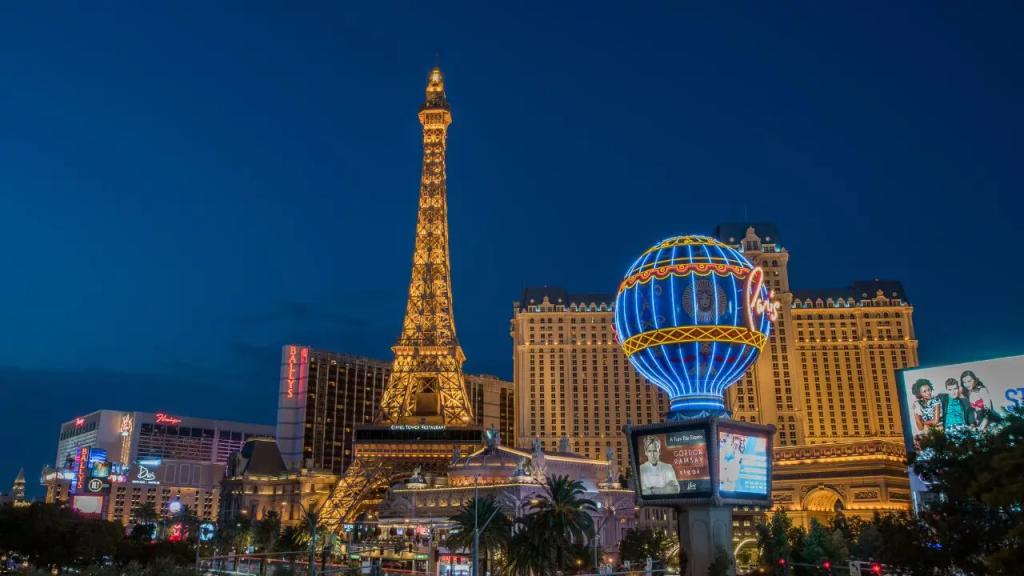 Las Vegas Strip illuminated at twilight featuring Eiffel Tower replica and Paris hotel for luxury travel