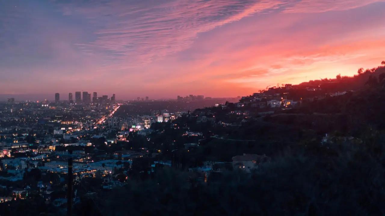 Los Angeles cityscape at sunset with Hollywood Hills showcasing premium empty leg flight destinations