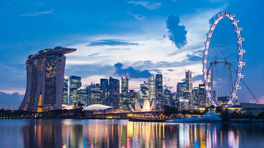 Singapore skyline at dusk featuring Marina Bay Sands and Singapore Flyer for luxury jet charter destinations